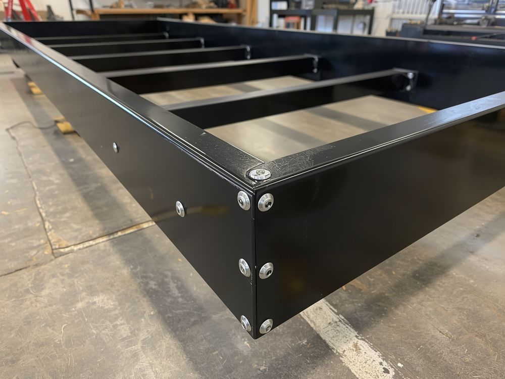 The same trailer tongue after the crack was gouged out and a new gusset welded in and cold-galvanized